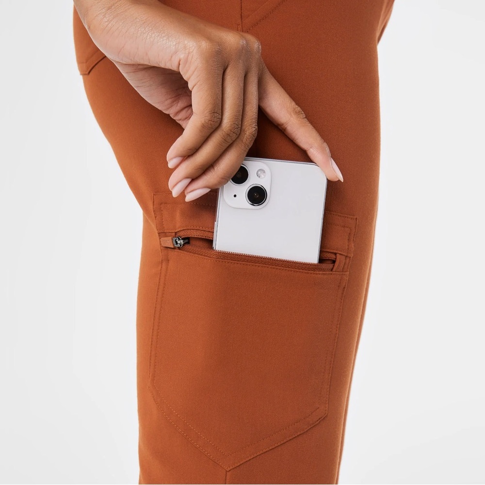 Figs Women's Scrub Pants a top in rust orange.